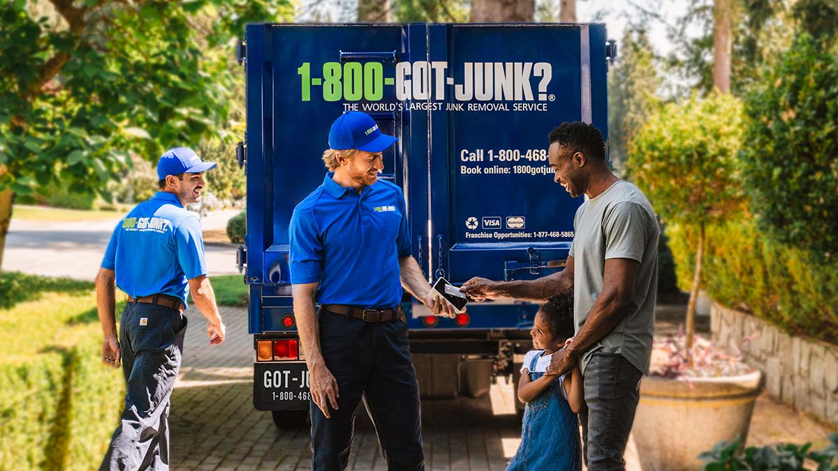 1-800-GOT-JUNK? helping a customer