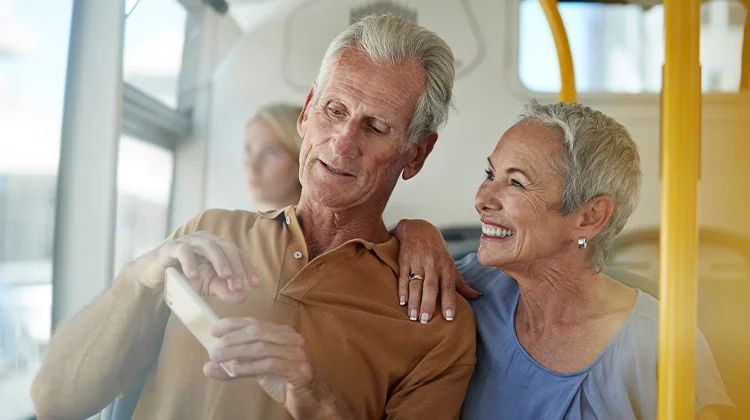 Older couple enjoying public transit ride