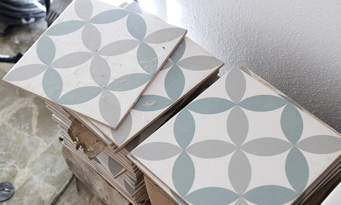 A pile of tile scraps and leftovers from a bathroom renovation.